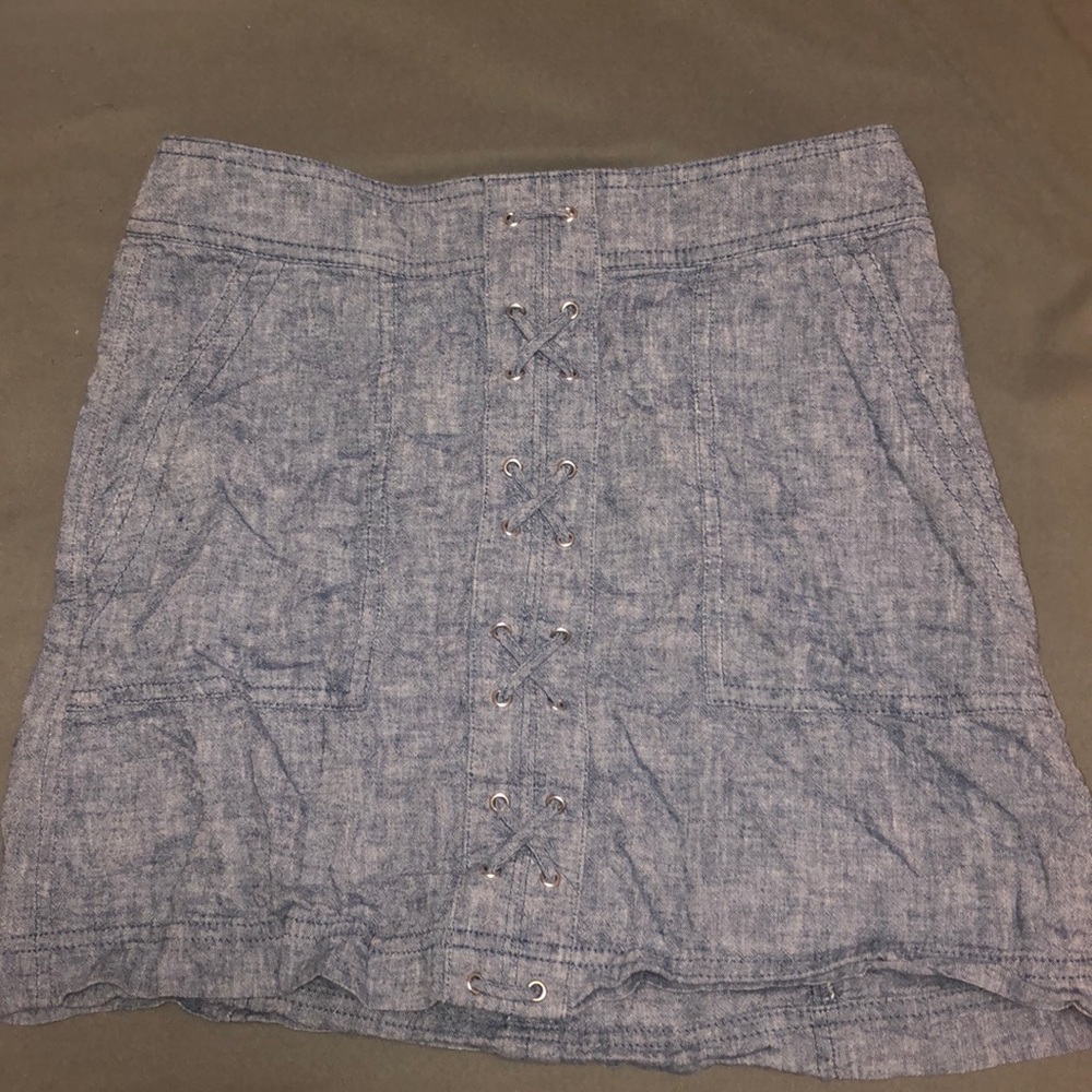 Mini skirt with cross stitch detailing.